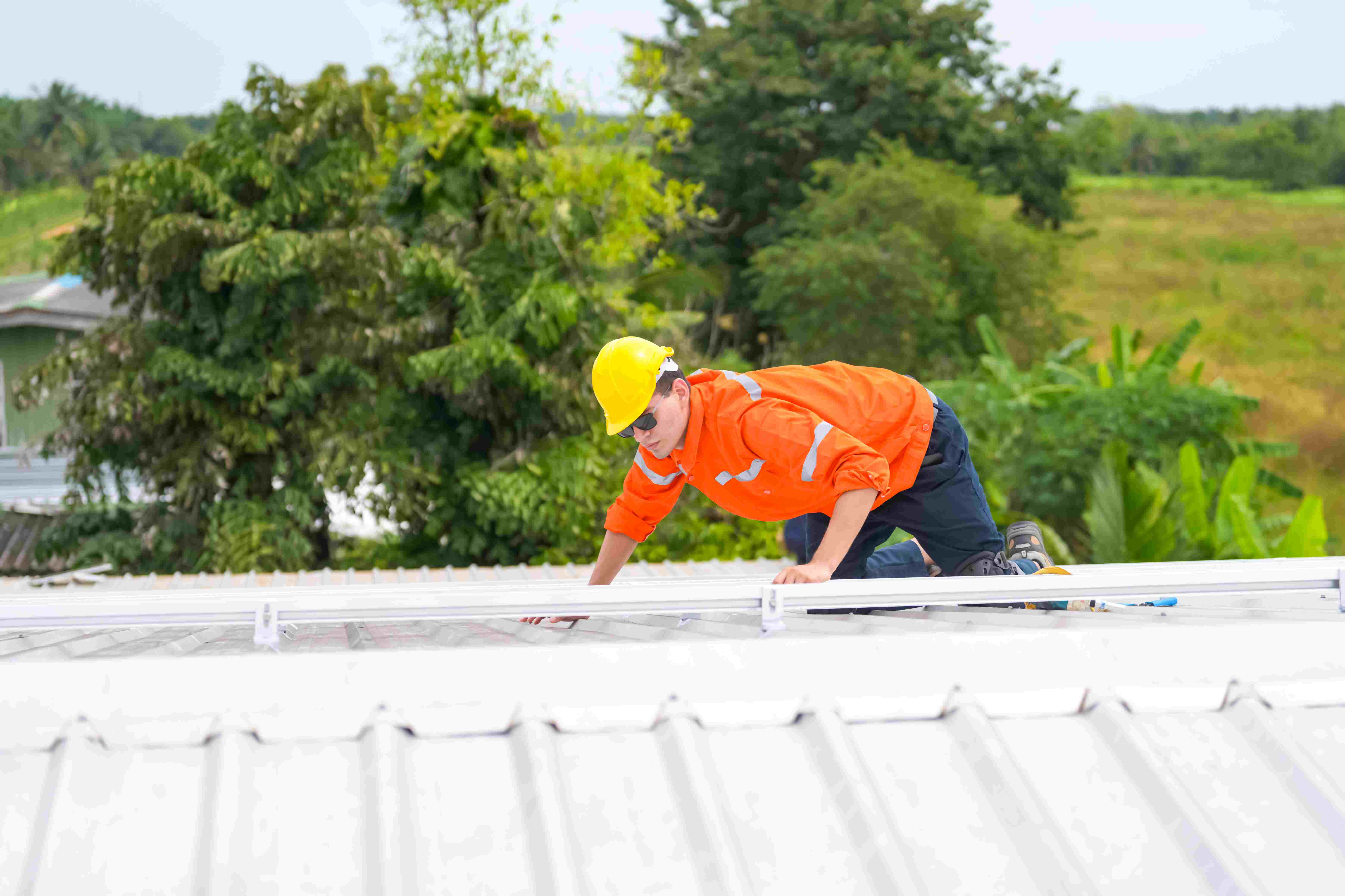 men-technicians-inspect-roof